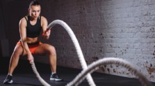 Woman doing battle rope workout